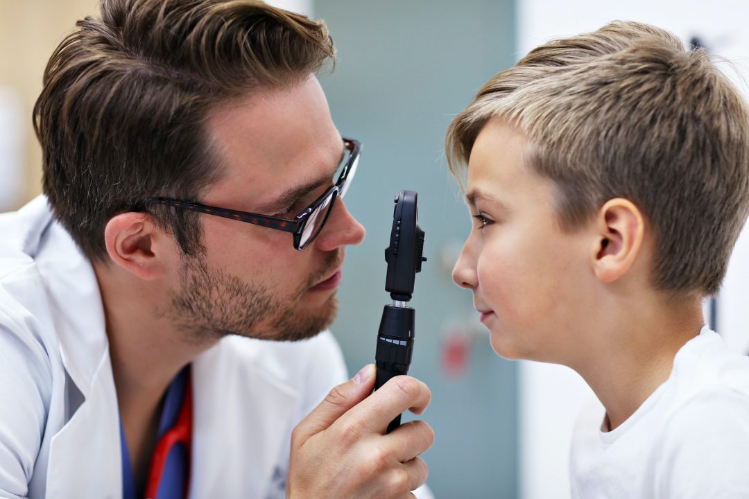 child-optometry-male-optometrist-optician-doctor-examines-eyesight-of-little-boy.jpg